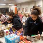 Students from 11 Alaska high schools take a lunch break Saturday during the two-day marathon of matchups during the Juneau Invitational Volleyball Extravaganza at Juneau-Douglas Yadaa.at Kalé High School. (Mark Sabbatini / Juneau Empire)