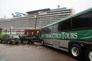 An Alaska Coach Tours bus sits parked beside the cruise ship dock in downtown Juneau. Alexandra Pierce, the CBJ tourism manager, said this years season went relatively smoothly and said the revival of tourism was overall well received by the residents and downtown businesses. (Clarise Larson / Juneau Empire)