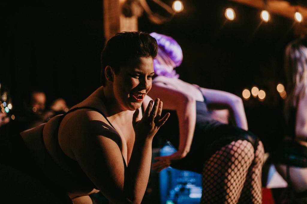 Kelsey Riker leans forward as she performs at a previous Nude & Rude event. Riker, the troupes host and master of ceremonies, is set to perform at the upcoming Halloween weekend Nude & Rude Revue burlesque and variety show at the Crystal Saloon. (Courtesy Photo / Sydney Akagi)
