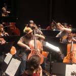 Christopher Koch, music director of the Juneau Symphony, conducts musicians through a rehearsal of Sibelius’ "Finlandia" on Tuesday at Juneau-Douglas High School: Yadaa.at Kalé. The composition is one of three scheduled to be performed Saturday and Sunday during the first mainstage concert of the ensemble’s 60th season. (Mark Sabbatini / Juneau Empire)