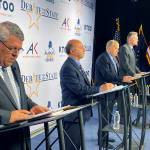 The four candidates for Alaska governor are shown preparing for a televised debate Wednesday in Anchorage. From left are Republican Charlie Pierce; Democrat Les Gara; former Gov. Bill Walker, an independent; and Gov. Mike Dunleavy, a Republican. (AP Photo/Mark Thiessen)