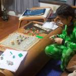 Mark Sabbatini / Juneau Empire 
Irynka Pomynalnyi, 10, plays with a chess set, Legos and other items in her familys Mendenhall Valley home on Oct. 14, about three weeks after the family arrived in Juneau after fleeing the war in their homeland Ukraine.