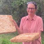 Engineer Robbin Garber Slaght holds prototype insulation panels made of wood fiber held together by a fungus species. (Courtesy Photo / Molly Rettig)