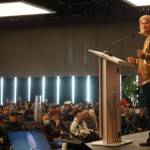Sen. Lisa Murkowski delivers a speech on Friday during the second day of the Alaska Federation of Natives 2022 convention. Murkowski, a Republican running for reelection, got a standing ovation and several rounds of applause during her speech. (Photo by Yereth Rosen / Alaska Beacon)