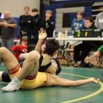 Thunder Mountain High School wrestler Brandon Day pins down his competition Saturday afternoon during the Brandon Pilot Invitational Wrestling Tournament at THMS. The Falcons had seven of its wrestlers make it into the finals and five took first in their weight divisions. (Clarise Larson / Juneau Empire)