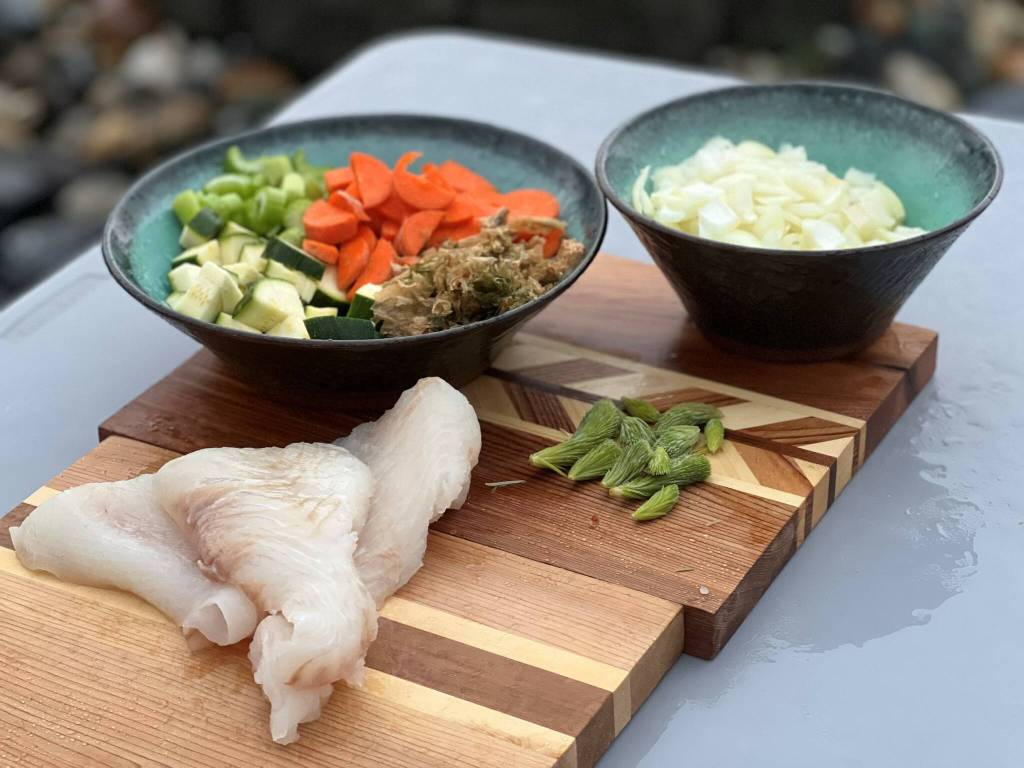 Vegetables, seaweed, spruce tips, and halibut ingredients for chowder. (Vivian Faith Prescott / For the Capital City Weekly)