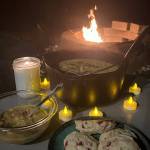 This photo shows a cauldron of halibut chowder around the firepit on a Fall evening. (Vivian Faith Prescott / For the Capital City Weekly)