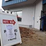 A person enters the Division of Elections office at the Mendenhall Mall, where early voting is taking place from 8 a.m. to 5 p.m. weekdays through Nov. 8. (Clarise Larson / Juneau Empire)