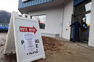 A person enters the Division of Elections office at the Mendenhall Mall, where early voting is taking place from 8 a.m. to 5 p.m. weekdays through Nov. 8. (Clarise Larson / Juneau Empire)