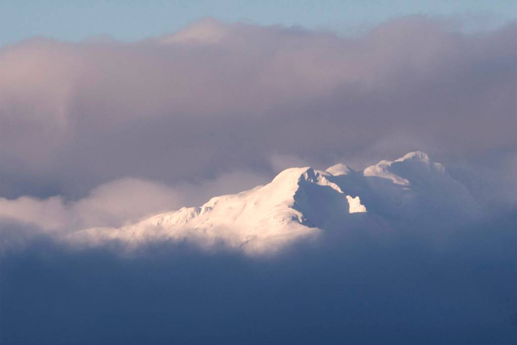 The Peak nearest Teardrop Lake peeks through the clouds. (Courtesy Photo / Kenneth Gill, gillfoto)