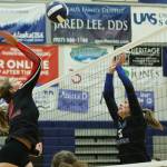 Ben Hohenstatt / Juneau Empire 
JDHS junior Mila Hargrave winds up to spike the ball while TMHS junior Ashlyn Gates attempts to deflect it.