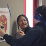 Floyd Dryden Middle School seventh grade students Ginayah Naur and Matthew Haven-Mar participate in one of the games set up to help raise awareness of Movember, a movement that focuses on mens health issues. Students had to try pinning a mustache to familiar cartoon characters while being blindfolded, the mustache is used as a symbol for the movement. (Jonson Kuhn / Juneau Empire)
