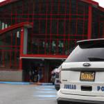 A Juneau Police Department vehicle parks in front of Juneau-Douglas High School: Yadaa.at Kalè in early September. Two high school students were arrested Thursday after reports that the students had allegedly communicated a plan to commit acts of violence toward a group of students from JDHS, according to Juneau Police Department. (Clarise Larson / Juneau Empire)