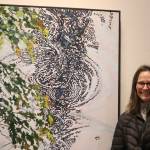 Kerry Kirkpatrick stands by her painting Ripple, one of many paintings included within her latest exhibit Capturing the Light on display at the Juneau-Douglas City Museum from Nov. 4 through Nov. 26. (Jonson Kuhn / Juneau Empire)