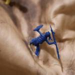 A tiny toy soldier stands in a fight position on Alison Bremner Nax̲shag̲eits animal hide piece titled Settle Down. (Clarise Larson / Juneau Empire)