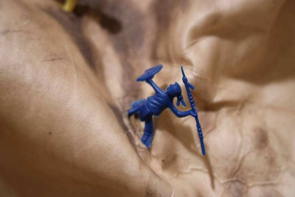 A tiny toy soldier stands in a fight position on Alison Bremner Nax̲shag̲eits animal hide piece titled Settle Down. (Clarise Larson / Juneau Empire)