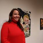 Alison Bremner Nax̲shag̲eit smiles in front of some of her pieces displayed in her new solo exhibit Midnight at the Fireworks Stand featured at the Alaska State Museum. Bremners 17 piece-collection of contemporary art depicts different stories and aspects of Tlingit and Indigenous life that often go unnoticed, through bright colors, unusual objects and humor.(Clarise Larson / Juneau Empire)