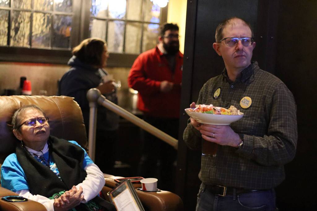 State Sen. Jesse Kiehl of Juneau, right, and lifelong Juneau resident Andrea Ebona Michel monitor election returns Tuesday night at a watch party hosted by U.S. Rep. Mary Peltolaa campaign at McGivneys Sports Bar Grill downtown. Kiehl, a Democrat, was the lone state senator who was unopposed in his race. Both of Juneaus Democratic state House representatives also won reelection. (Mark Sabbatini / Juneau Empire)