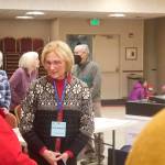 Mark Sabbatini / Juneau Empire 
Brenda Knapp, an official poll watcher at the Elizabeth Peratrovich Hall polling station, chats with a voter late Tuesday morning. While some election workers and voters nationwide have reported being threatened by observers, Knapp said part of her role is to watch for and report troublemakers.
