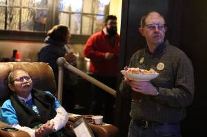 State Sen. Jesse Kiehl of Juneau, right, and lifelong Juneau resident Andrea Ebona Michel monitor election returns Tuesday night at a watch party hosted by U.S. Rep. Mary Peltolaa campaign at McGivneys Sports Bar Grill downtown. Kiehl, a Democrat, was the lone state senator who was unopposed in his race. Both of Juneaus Democratic state House representatives also won reelection. (Mark Sabbatini / Juneau Empire)