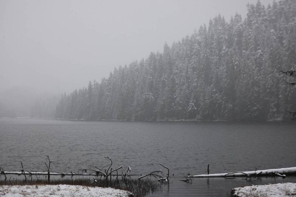 Snow flakes and mist fill the air over Auke Lake on Thursday. Juneau saw its first serious snowfall of the season. About five to seven inches of snow were forecast for Juneau by midday Thursday, with about five inches reported in the Mendenhall Valley by about 10 a.m., said Brian Bezenek, lead meteorologist for the National Weather Service in Juneau. (Ben Hohenstatt / Juneau Empire)
