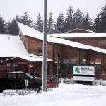 Mark Sabbatini / Juneau Empire 
A truck with a snowplow departs the cleared parking lot at the Ethel Lund Medical Center on Thursday morning.