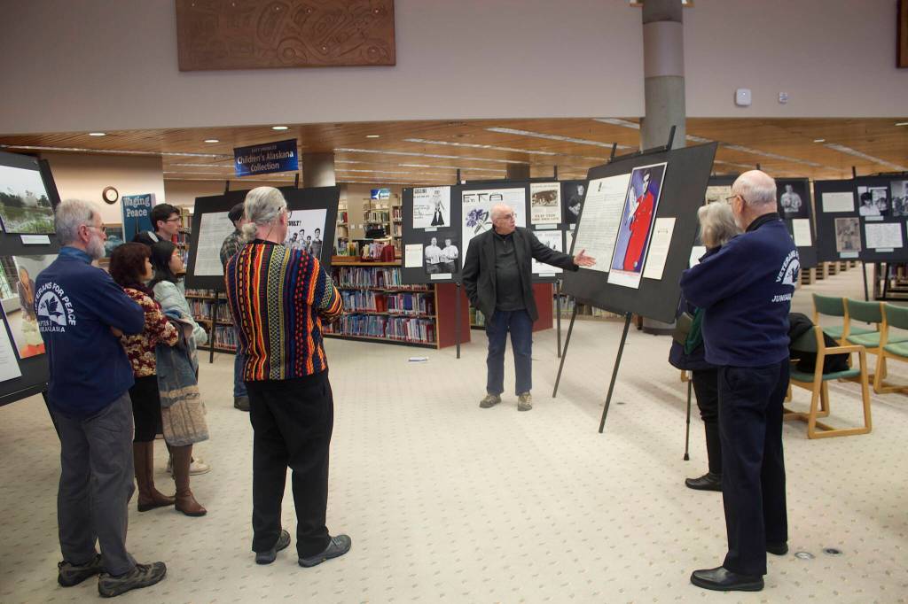 Mark Sabbatini / Juneau Empire 
A group of Juneau veterans, students, instructors and others listen to Ron Carvers overview of the exhibit Waging Peace In Vietnam: The Story of U.S. Soldiers and Veterans Who Opposed the War during a preview event Thursday in the University of Alaska Southeast library. universitys library.