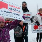 Former Gov. Sarah Palin, a Republican candidate for Alaskas sole seat in the U.S. House, meets with supporters waving signs on Tuesday in Anchorage. Palin, who is trailing Democratic U.S. Rep. Mary Peltola in the vote count so far, nonetheless is declaring herself the presumptive winner and has named a chief of staff  despite also claiming the election was rigged against her. (AP Photo/Mark Thiessen)