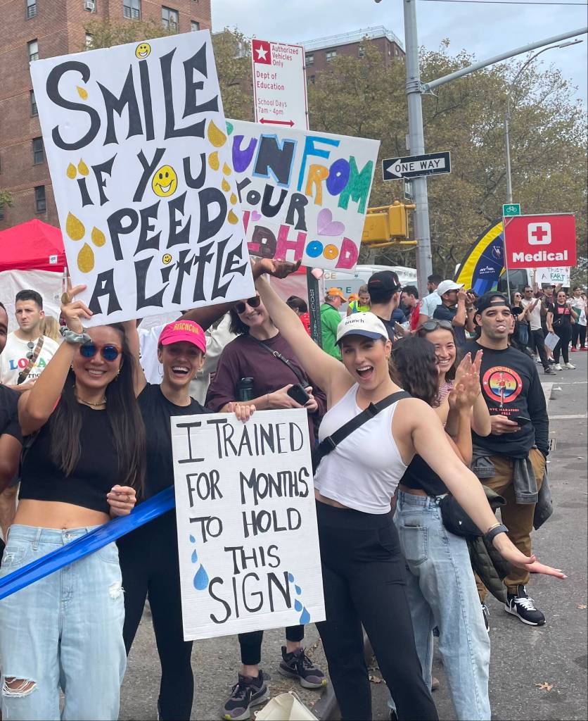 Courtesy Photo / Mary Rozell 
Fans of the New York City Marathon hold signs for some of the 50,000 runners who passed them on Nov. 6, 2022.