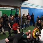 The crowd cheers on a lifter as he attempts his final round of bench pressing at the first-ever USA Powerlifting Coastal Clash competition hosted in Juneau Saturday afternoon. (Clarise Larson / Juneau Empire)