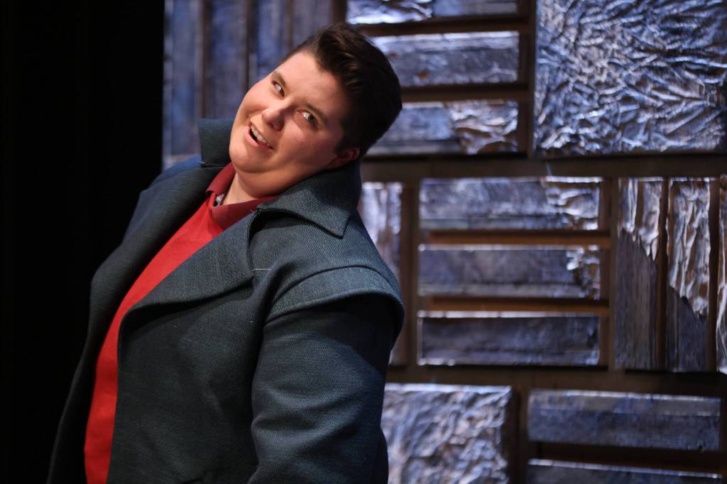 Scratch (Kelsey Riker) enters a scene with a devilish grin during rehearsal for Theatre in the Roughs production of Witch. The play, a dark comedy based on a 1600s drama, opens on Friday. (Ben Hohenstatt / Juneau Empire)