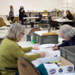 Mark Sabbatini / Juneau Empire 
Pat Tynan, left, and Tom Melville, review absentee ballots Tuesday at the Division of Elections office at the Mendenhall Mall. The review process is taking place in a separate room from where ballots are being tallied for the official results.