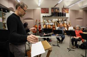 Clarise Larson / Juneau Empire 
Mike Bucy keeps the temp while he conducts local composer and musician Ben Holtzs piece, Atmosphere with Radio Occultation, during Con Brio Chamber Series Tuesday evening rehearsal.