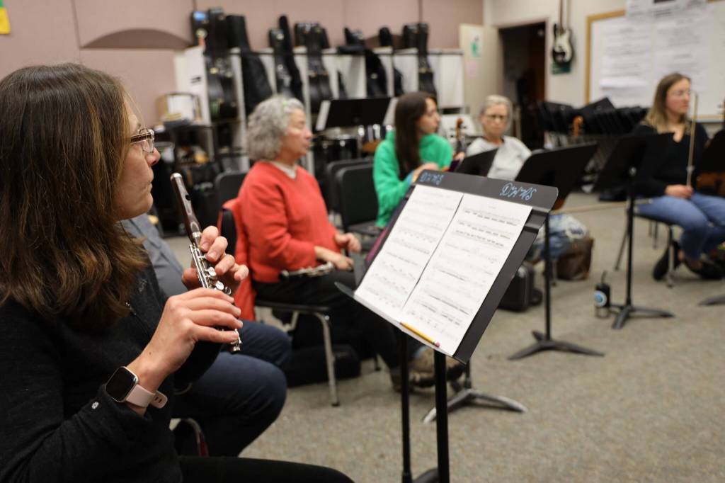 Clarise Larson / Juneau Empire 
Sally Schlichting holds her piccolo mid-song during Con Brio Chamber Series Tuesday evening rehearsal. She was joined by Jetta Whittaker on oboe, Eleni Levi, Lisa Ibias and Lindsay Clark on violins.