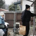 Mark Sabbatini / Juneau Empire 
Barbara Bechtold and John Tomaro deliver a Thanksgiving meal package to a Mendenhall Valley home on Saturday. The couple, both of whom have lived in Juneau since the 1970s, have made the deliveries and taken part in other volunteer efforts for many years. The estimated 300 to 400 packages being delivered this year are a collaborative effort by St. Vincent de Paul, The Salvation Army, The Glory Hall and other local entities.