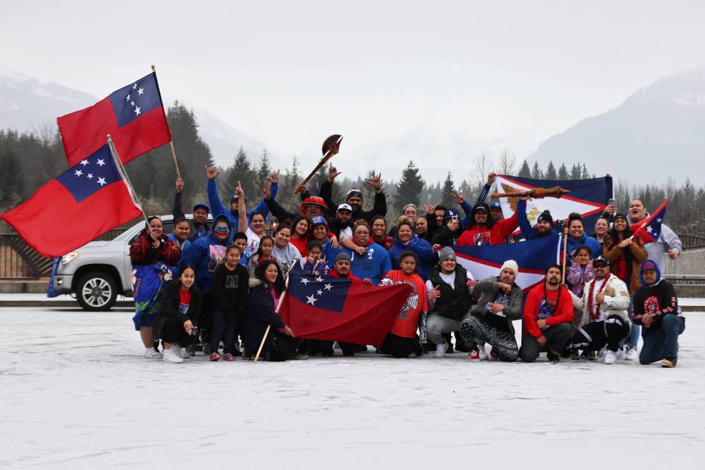 Dozens of fans celebrate Samoas unprecedented Rugby League World Cup finals appearance Saturday in the Kaxdigoowu Héen Dei, also known as the Brotherhood Bridge Trail, parking lot ahead of a procession around Juneau. (Ben Hohenstatt / Juneau Empire)
