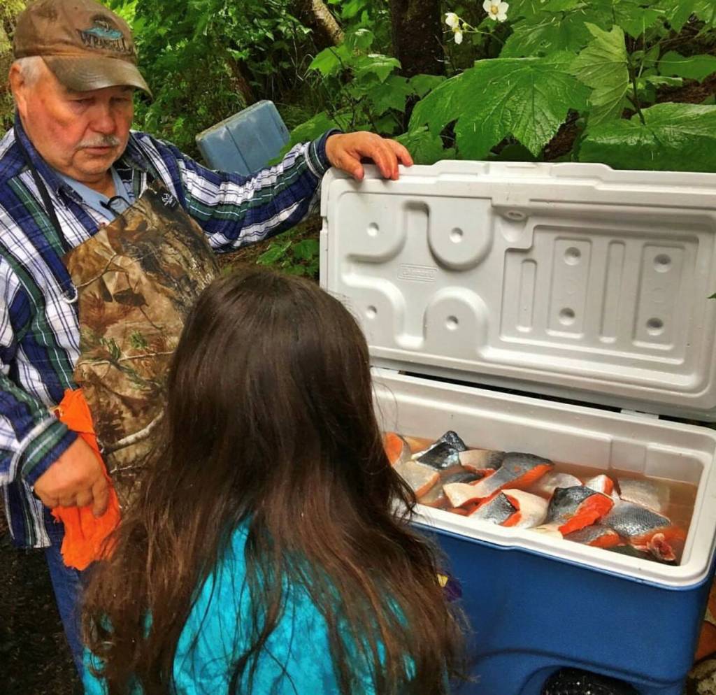 Mickey Prescott teaches great granddaughter Rhiannon Nore how to brine salmon. (Courtesy Photo / Vivian Faith Prescott)