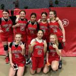 From left to right, Floyd Dryden A team members Cassie Chenoweth, Aurora Lee, Kyndal Secada, Ari Maake, Addy Hartman, Alyssa Travis, Riley Moorehouse and Riley Schultz smile for a photo. (Courtesy / Jessica Nelson)