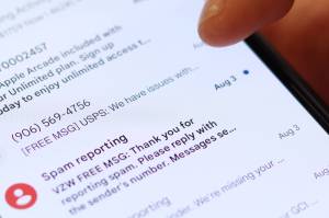 A cellphone screen displays spam text messages. During busy shopping season, scammers pretending to be other people, businesses or agencies frequently attempt to gain personal information via spoofed text messages, emails or phone calls. (Ben Hohenstatt / Juneau Empire)