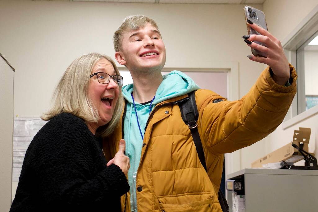 Alaska Division of Elections Director Gail Fenumiai, who teared up while thanking election workers before the ranked choice tally Wednesday in her Juneau office, poses for a selfie afterward with Robin ODonoghue, policy and communications manager for the Alaska Public Interest Research Group. He was one of only a few observers to watch the process despite the attention and controversy it attracted during the campaign. The election drew the lowest voter turnout recorded in state history, which ODonoghue blamed less on ranked choice voting than I would really say people are discouraged with government in general right now. (Mark Sabbatini / Juneau Empire)
