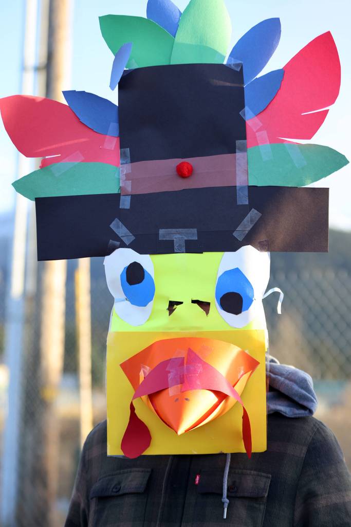 Jace Kihlmire wore some of the most elaborate headgear of any runner during the ninth annual Turkey Trot on Thursday. (Ben Hohenstatt / Juneau Empire)