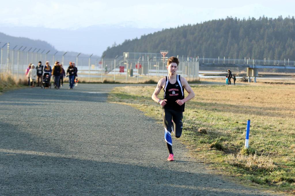 Finn Morley, a JDHS alum, was the first 5K runner to cross the Turkey Trots finish line. When asked, Morley, who finished with a time of 16 minutes and 42 seconds, said his favorite Thanksgiving side is cranberry sauce. (Ben Hohenstatt / Juneau Empire)