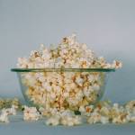 This photo shows a bowl of popcorn. "I love popcorn. When I play those ice-breaker games where you introduce yourself and name a favorite food, I always say, 'Peggy, popcorn.' writes Peggy McKee Barnhills. "It has a pleasing alliteration, making it easy for people to remember my name. Plus, it’s the truth. I love popcorn." (Georgia Vagim / Unsplash)