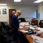 Steve Lewis, foreground, and Stephen Sorensen from the Alaska State Review Board scan ballots from precincts where they were hand counted at the Division of Elections office Nov. 15. Board officials spent the period between the Nov. 8 election and its certification Wednesday performing about 20 different to verify the results. (Mark Sabbatini / Juneau Empire)