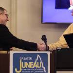 Mark Sabbatini / Juneau Empire
Juneau state Sen. Jesse Kiehl, left, gives a legislative proclamation to former longtime Juneau Assembly member Loren Jones, following Kiehls speech at the Juneau Chamber of Commerces weekly luncheon Thursday at the Juneau Moose Family Center.