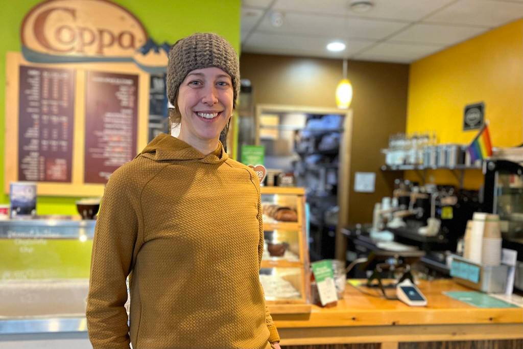 Maddie Kombrink poses in the lobby of Coppa Cafe where she is now the new owner after working as an employee on and off for the last five years. (Jonson Kuhn / Juneau Empire)