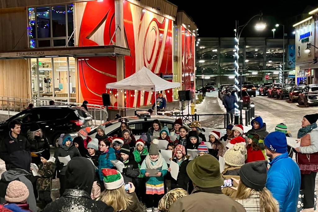 The children of Juneau Alaska Music Matters sing Rudolph the Red-Nosed Reindeer and other classic holiday songs in downtown Juneau during this years Gallery Walk. (Jonson Kuhn / Juneau Empire)