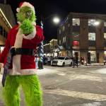 Even the Grinch got into the holiday spirit at Juneau's Gallery Walk 2022 on Friday, Dec. 2. (Jonson Kuhn / Juneau Empire)