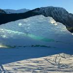 Depending on where you stood, this iceberg resembled a wave or a shark, writes Deana Barajas of this photo taken at Mendenhall Lake. This is the best angle, which almost matches the mountains. The sun shining behind it made some of the iceberg appear to glow. (Courtesy Photo / Deana Barajas)