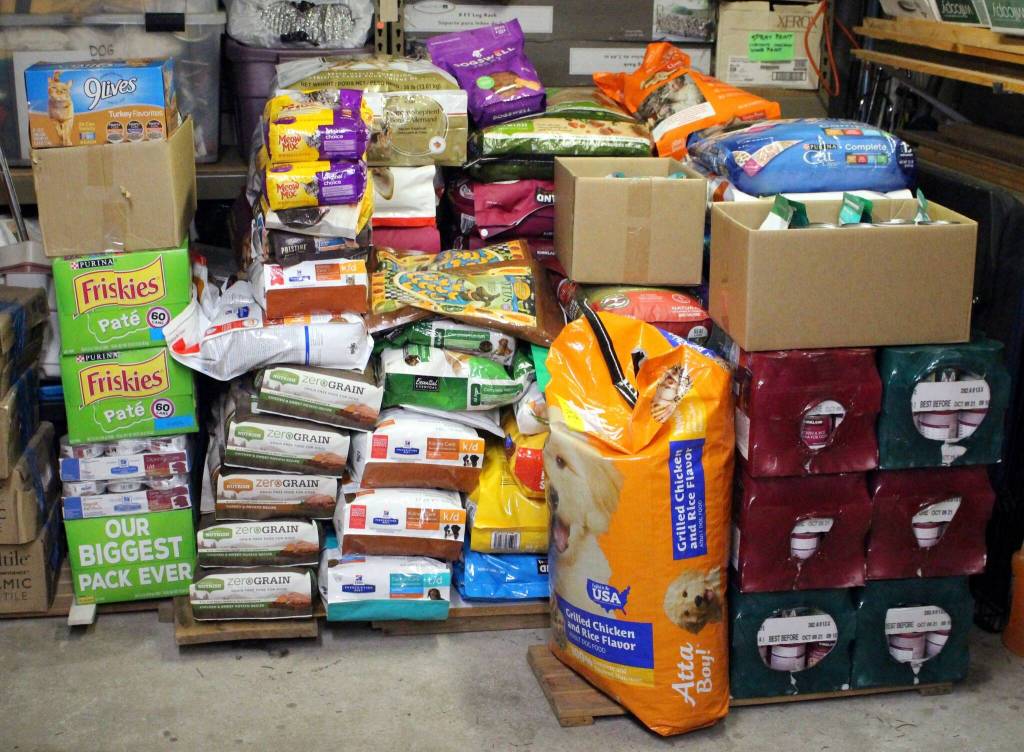 Stacks of dog and cat food sit on pallets after being donated during a previous Holiday Cat and Dog Food Drive hosted by the Grateful Dogs of Juneau. (Courtesy Photo / George Utermohle)